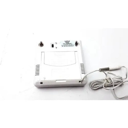 White plastic digital thermometer with coiled gray cable and display switch from fisher brand traceable thermometer