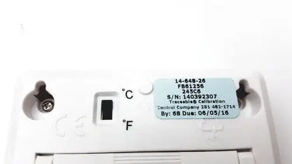 White plastic fisher brand traceable thermostat with light blue label showing serial and calibration details