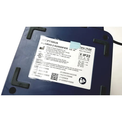Blue plastic paykel airvo 2 pt100us respiratory humidifier with black mounts and white product label visible