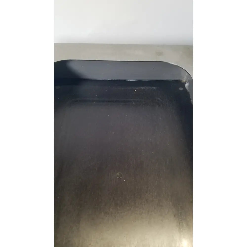 Black rectangular griddle pan with smooth reflective surface and rounded corners used in fisher scientific tissueprep flotation bath