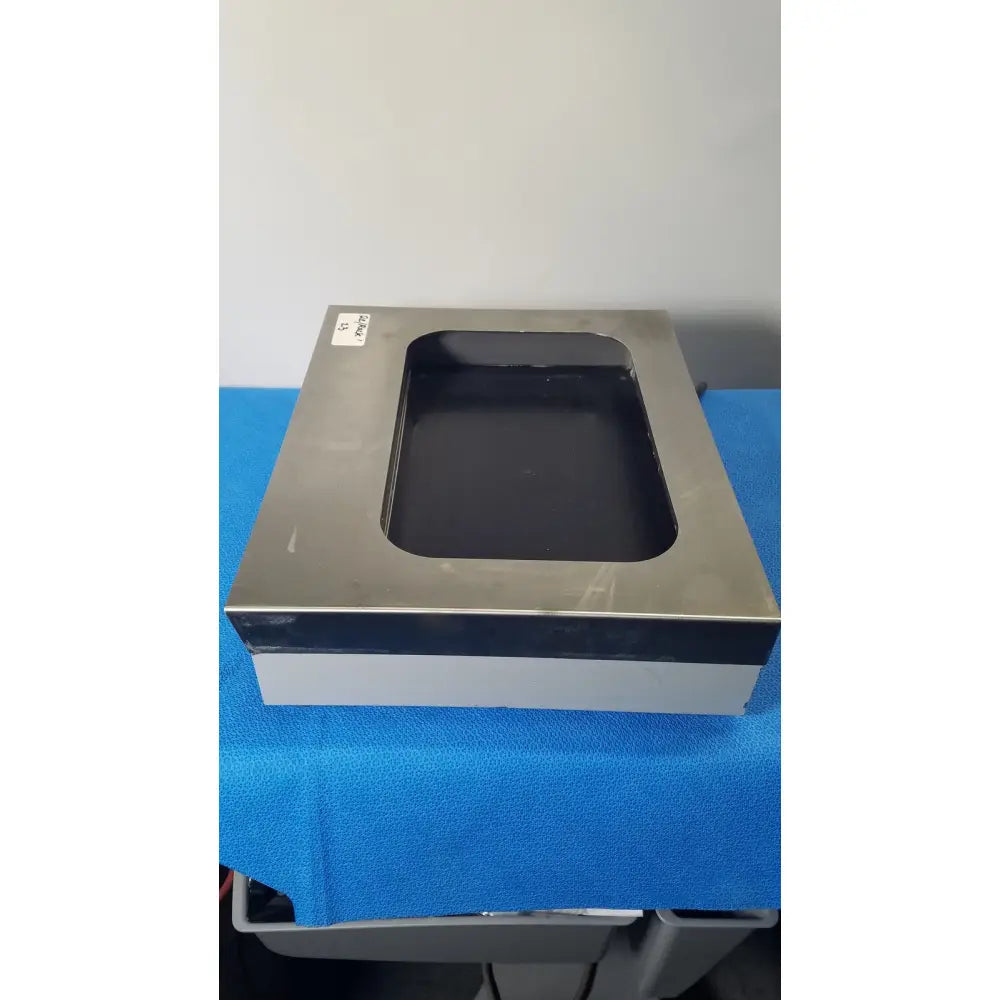 Silver metallic rectangular tissueprep flotation bath platform with black recessed center and white base by fisher scientific