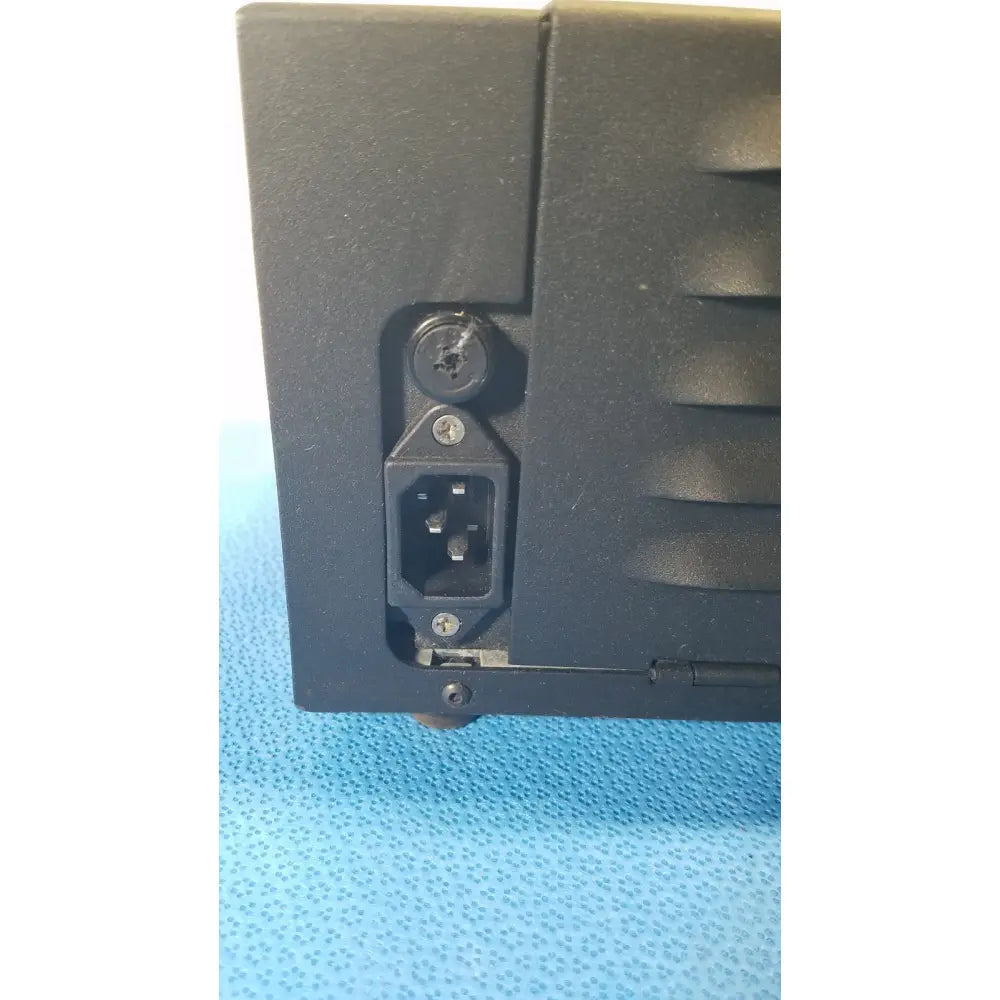 Black plastic power supply unit with three-pronged ac input and screw-fastened cover for fisher scientific dual illuminator