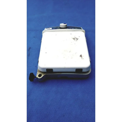 White rectangular fisher scientific isotemp digital hotplate with blue control panel and black knob showing wear
