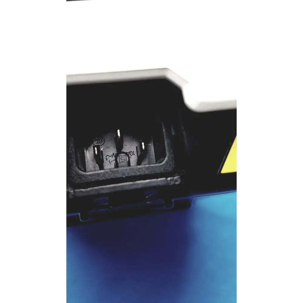 Black plastic power input port with three metallic prongs and yellow warning triangle on back of fisher scientific isotemp digital hotplate