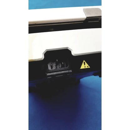 White and black fisher scientific isotemp digital hotplate stirrer with yellow warning triangle on the side panel