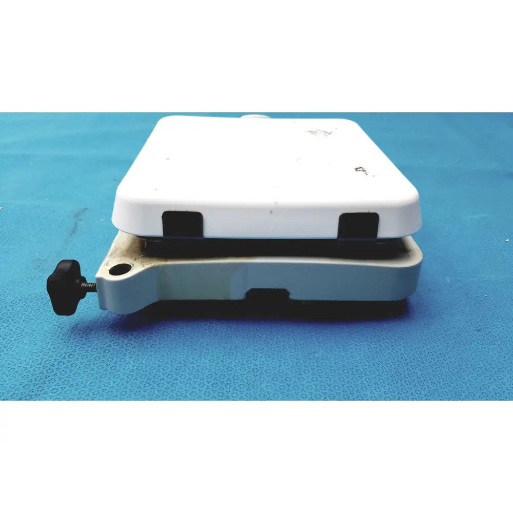 White plastic laboratory balance with black adjustment knob and gray base for fisher scientific isotemp digital hotplate use
