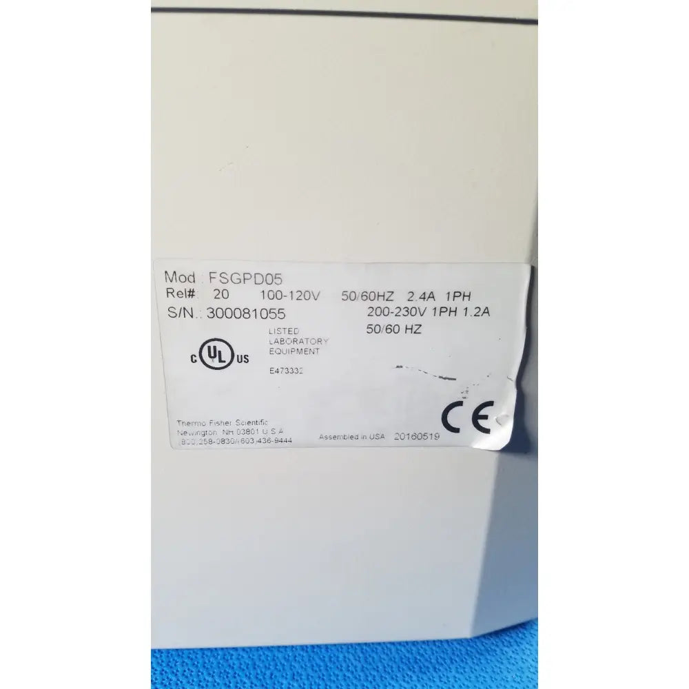 White rectangular label with black text and certification marks on beige fisher scientific isotemp gpd 05 water bath laboratory equipment