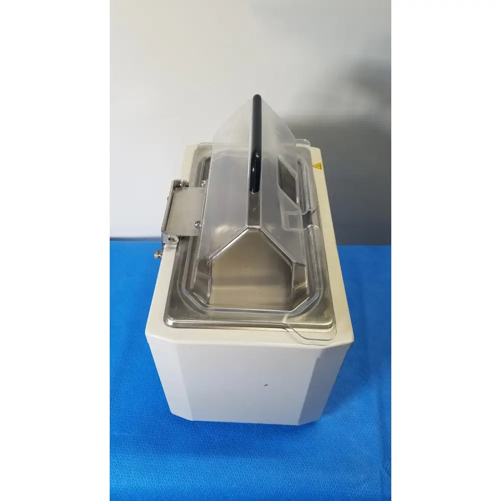 White rectangular water bath with transparent lid and black handle by fisher scientific isotemp gpd for laboratory use