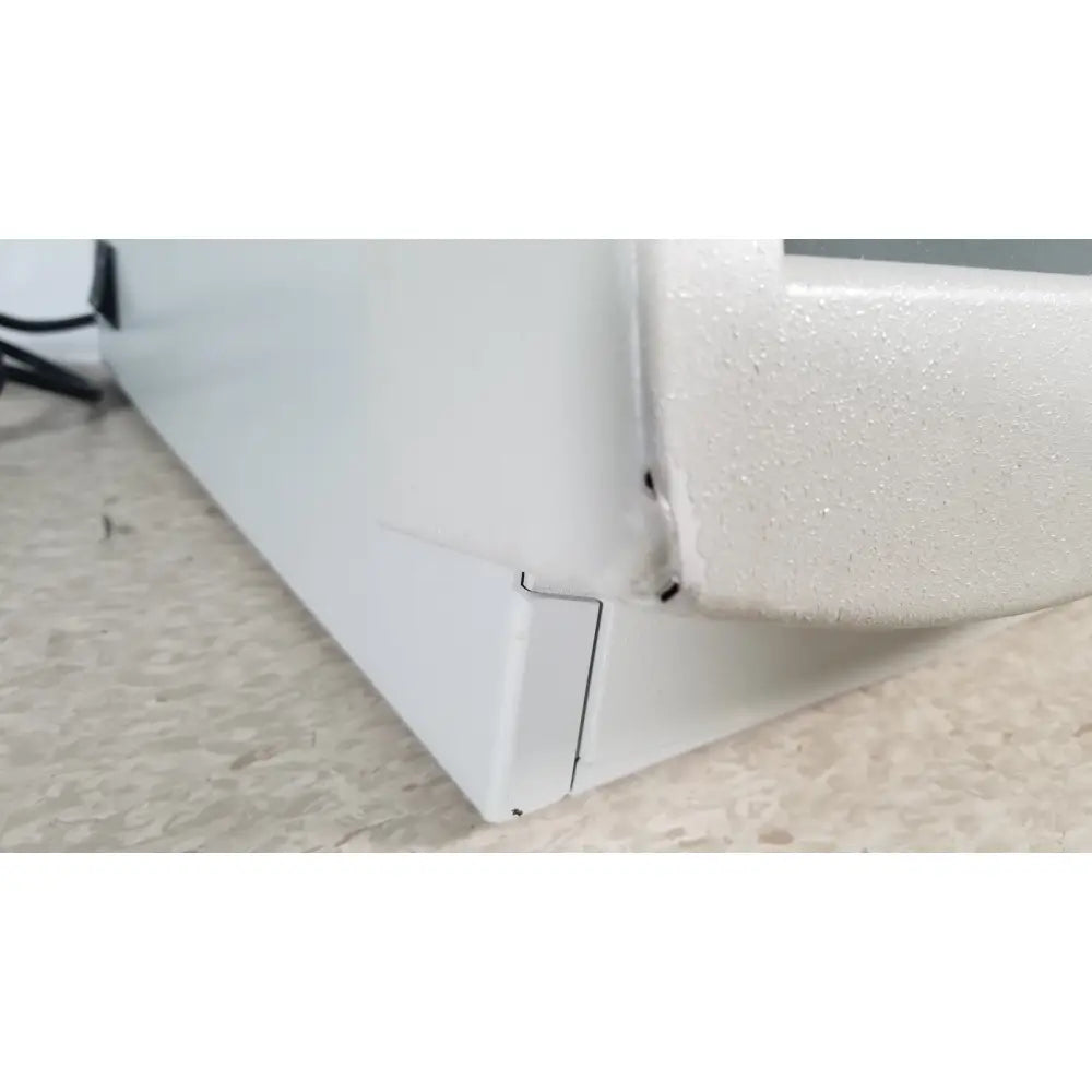 White plastic corner with textured surface and seam of fisher scientific marathon 16km benchtop appliance 60hz