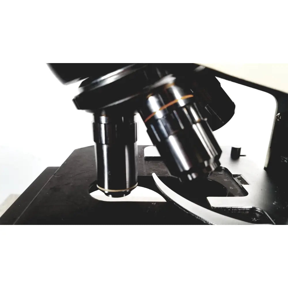 Black Fisher Scientific MicroMaster microscope with metallic lenses and precision stage model 12-561-3faz