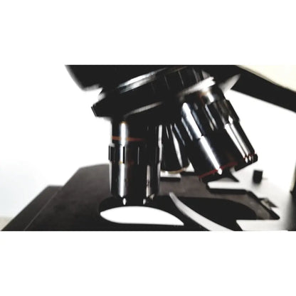Black metal fisher scientific micromaster microscope with multiple objective lenses and specimen stage 12-561-3faz