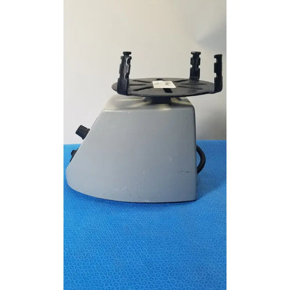Gray plastic Fisher Scientific mini vortex mixer with black adjustable clamps and circular platform for laboratory use