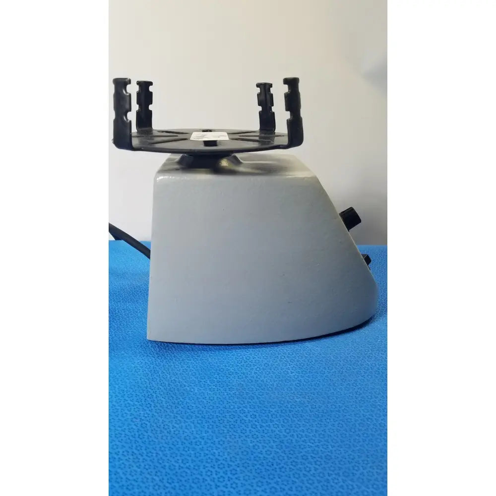 Gray plastic Fisher Scientific mini vortex mixer with black rotor and clamps for laboratory sample mixing use