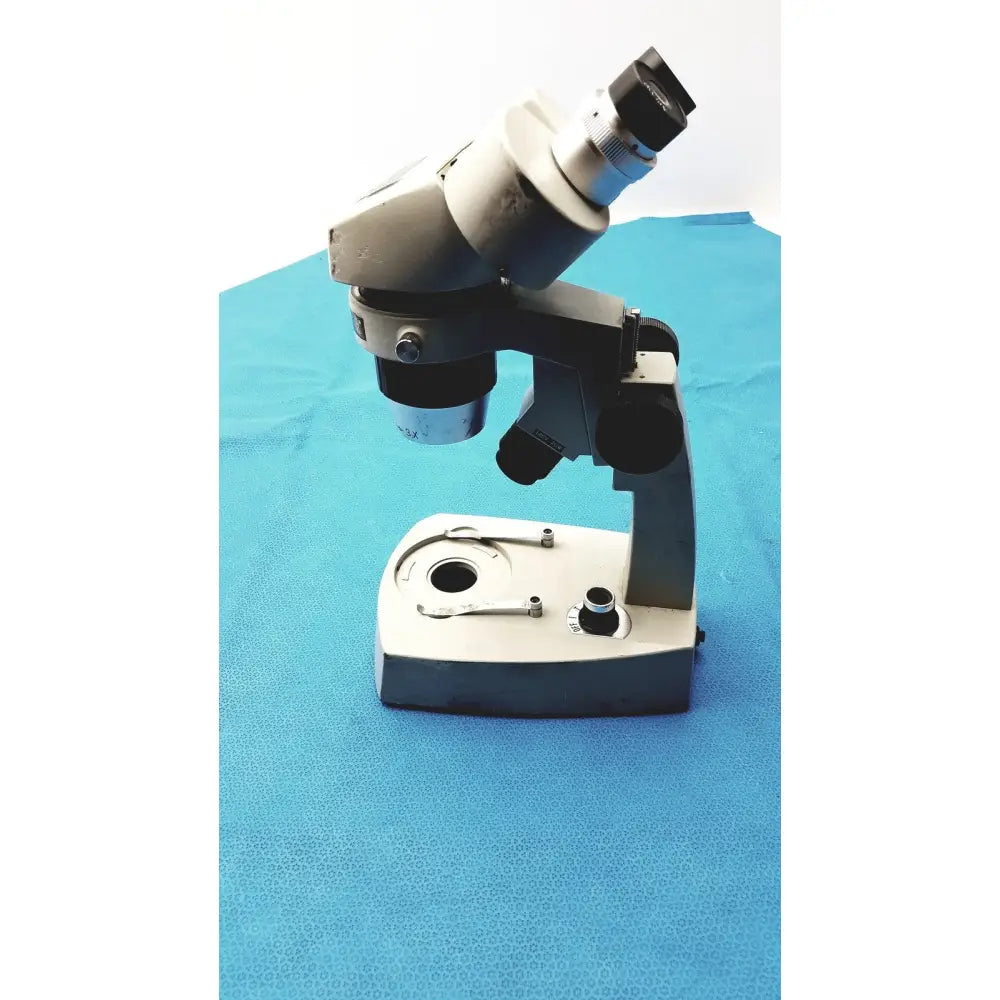Silver and black Fisher Scientific Stereomaster II Microscope with adjustable eyepieces and sturdy base for precise observation