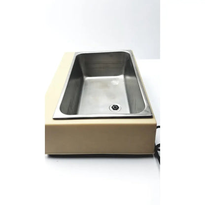 Stainless steel sink embedded in beige plastic base of fisher scientific versa-bath model 139 heated water bath