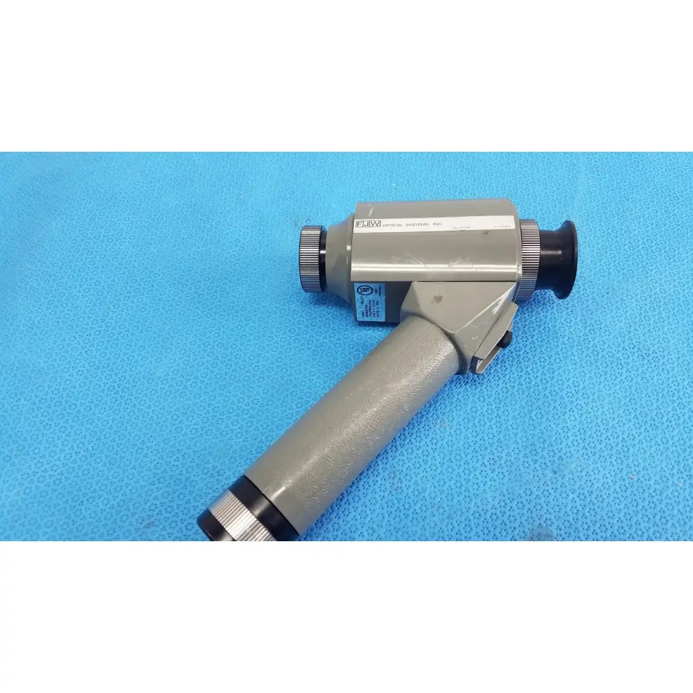 Gray handheld infrared viewer with black accents and textured grip featuring fluvo brand by FJW Optical Systems