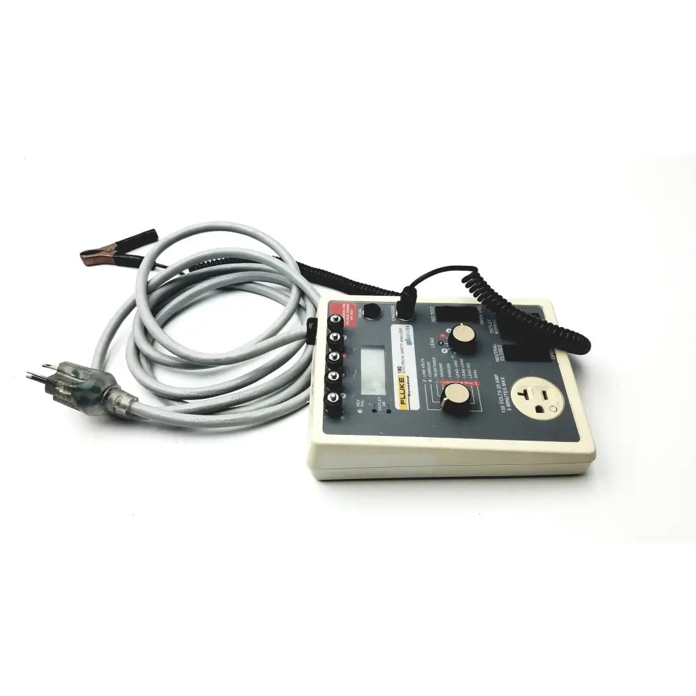 Fluke 180 electrical safety analyzer with Fluke 702a test instrument, gray coiled cable, multiple ports, and lcd screen