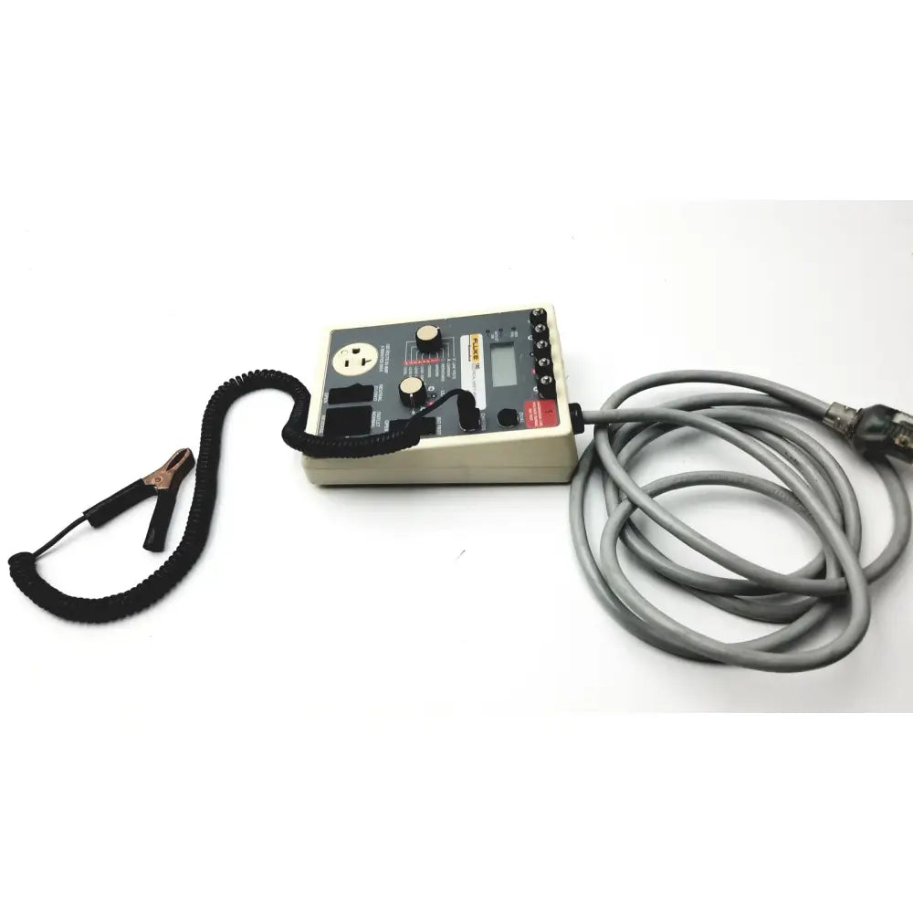 Beige rectangular fluke 180 electrical safety analyzer with black coiled cable and alligator clips for electrical safety testing