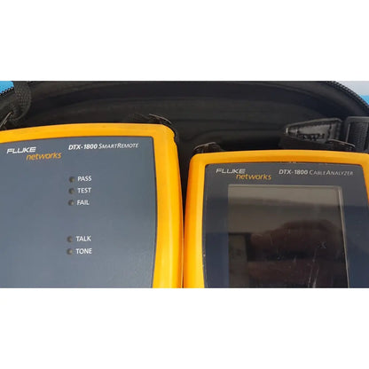 Two yellow fluke dtx-1800 network cable certifiers including a smartremote and a cable analyzer for testing network cables