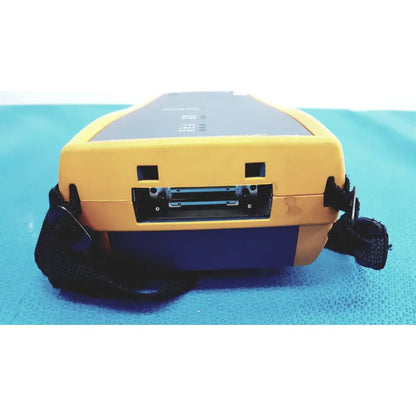 Fluke DTX-1800 yellow and blue handheld network cable certifier with black strap for cable analysis and testing