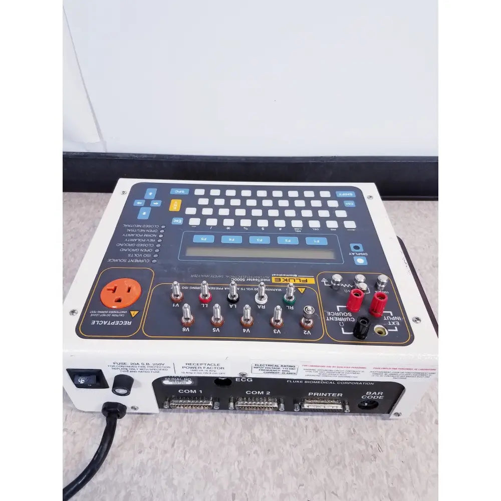 White and black fluke medtester 5000c automated electrical safety analyzer with keypad and multiple input ports back view