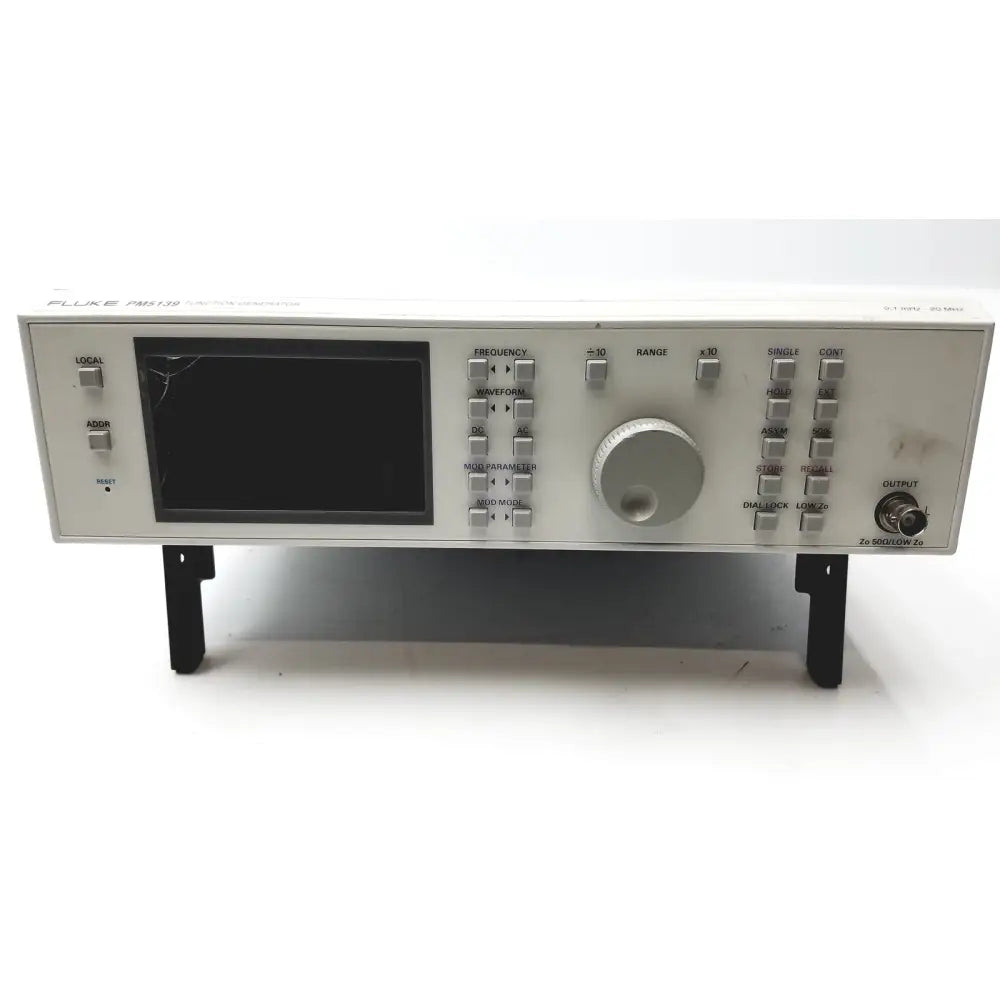 Silver fluke pm5139 function generator with black screen, multiple control knobs, buttons, and output port for signal testing