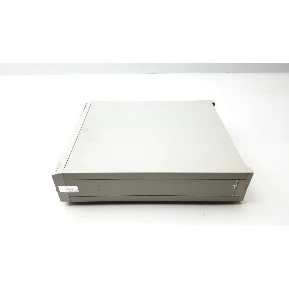 Gray metal server rack with sleek rectangular design and subtle branding shown with fluke pm5139 function generator