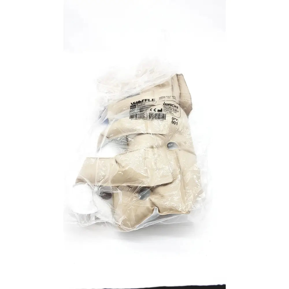 Beige waffle 504fw protective heel gloves with waffle texture in clear plastic packaging for medium foot support