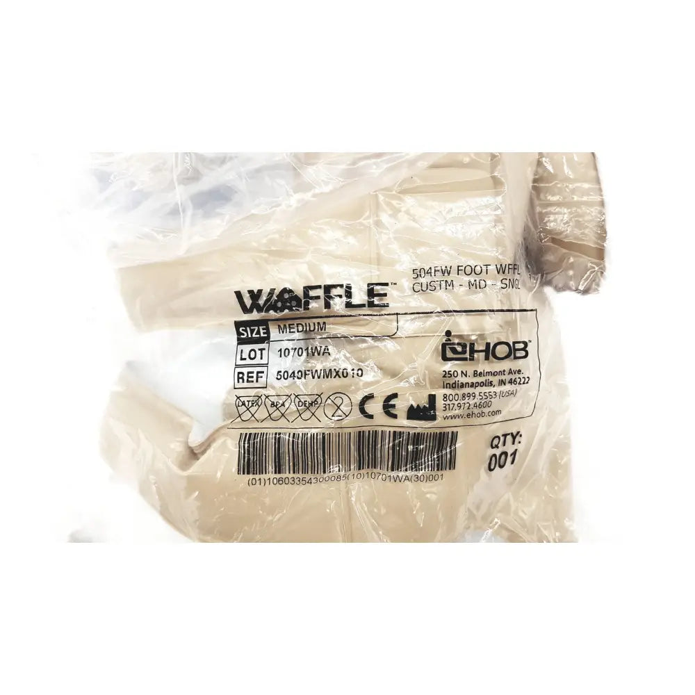 Medium beige waffle 504fw foot waffle 504fw ref foot warmer packaged in clear plastic with brand details visible