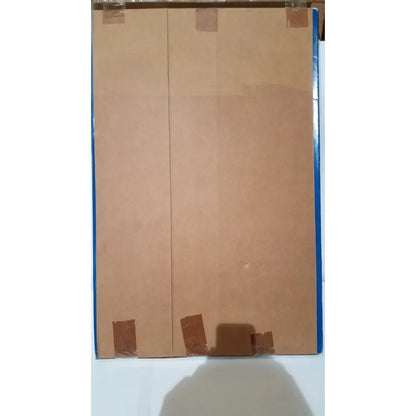 Two brown cardboard panels taped together representing the back side of the freedom grip plus bed handle patient support aid