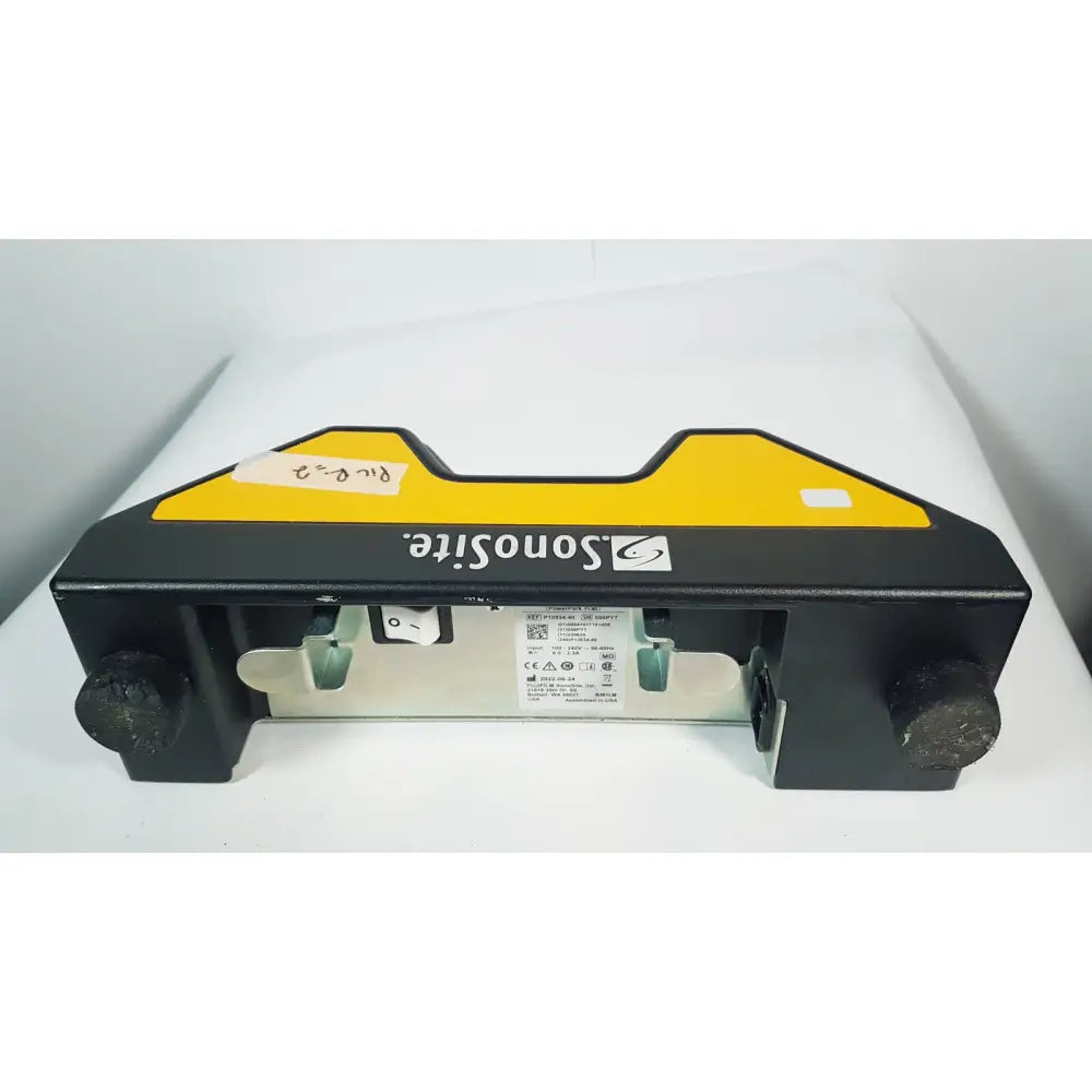 Fuji film sonosite power pack dock featuring a black and yellow sonosite ultrasound machine with a sturdy rectangular design