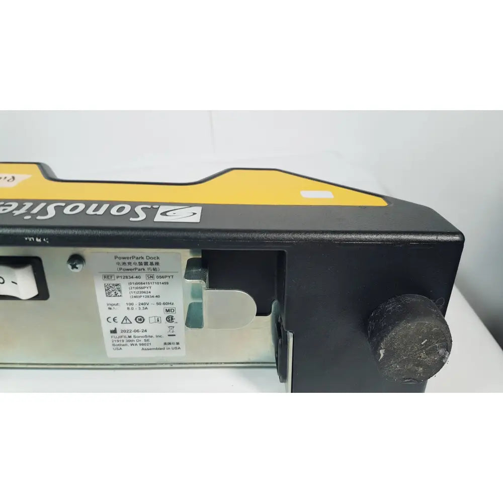 Fuji film sonosite p12834-40 power pack dock in black and yellow matte finish with technical specifications label