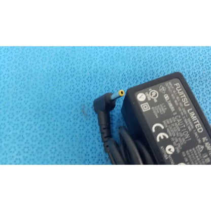 Black plastic fujitsu ac adapter power supply 19v 3.16a with coiled cord and yellow-tipped angled connector