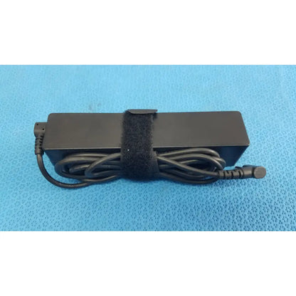 Black rectangular fujitsu ac adapter power supply 19v 3.16a with coiled cord and velcro strap for laptop charging