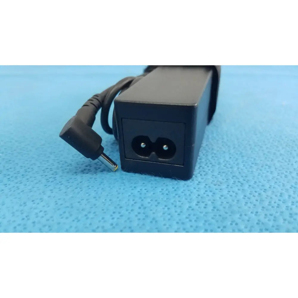Black rectangular fujitsu ac adapter power supply 19v 3.16a with coiled power cord and angled plug for laptop use