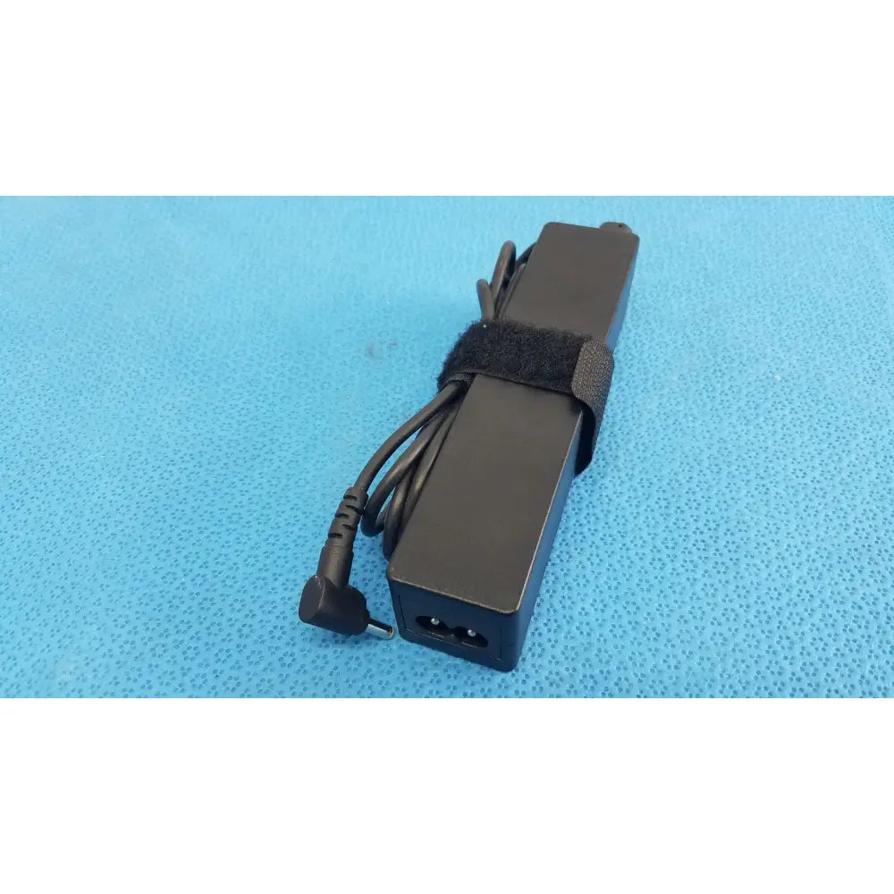 Black rectangular fujitsu ac adapter power supply 19v 3.16a with coiled cord and velcro strap for laptops