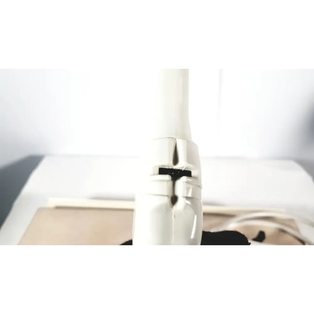 White plastic hair dryer nozzle with black rubber seal and metallic hinge detail for fukuda denshi ultrasound probe trans vaginal use