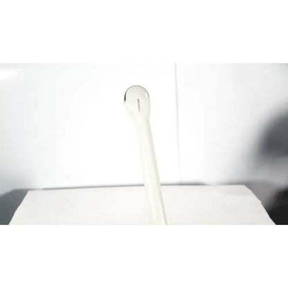 White plastic spoon with smooth rounded handle shown alongside fukuda denshi ultrasound probe trans vaginal device