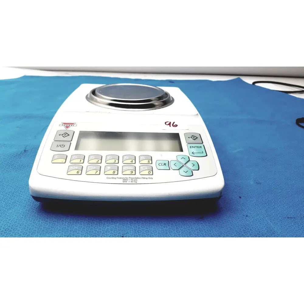 Fulcrum Torbal DRX300 white digital scale with stainless steel platform and light blue function buttons for precise weighing