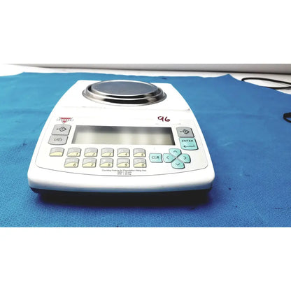 Fulcrum Torbal DRX300 white digital scale with stainless steel platform and light blue function buttons for precise weighing