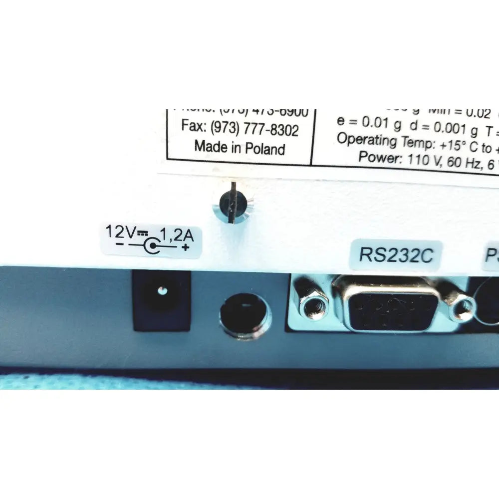 White plastic back panel of fulcrum torbal drx300 scale balance with 12v power input and rs232c serial connector