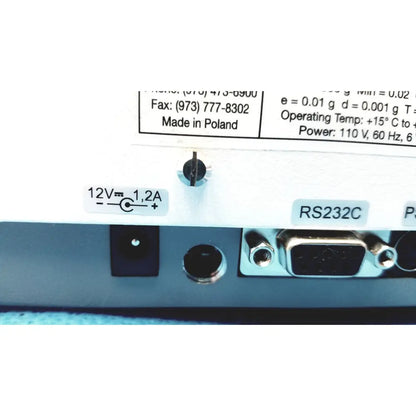 White plastic back panel of fulcrum torbal drx300 scale balance with 12v power input and rs232c serial connector