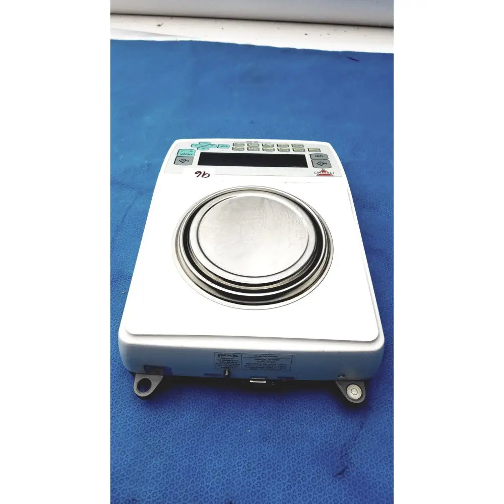 White Fulcrum Torbal DRX300 digital laboratory balance with circular metallic weighing platform and gray control buttons