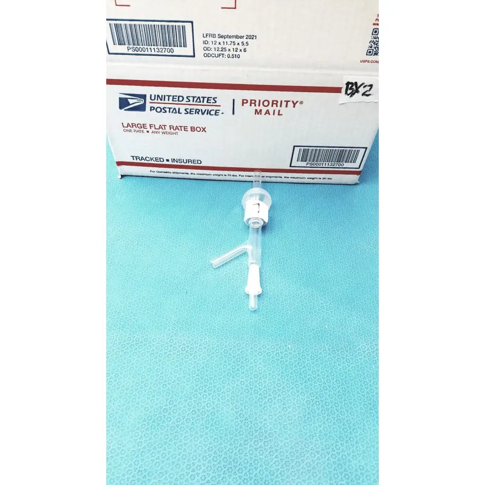 Clear plastic gas inlet adapter with white connector and three-pronged adapter for dual hose connections use