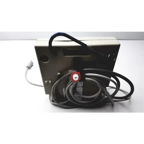 Beige rectangular Gaymar SPR Plus III electronic device with coiled black cables and red circular connector on back side