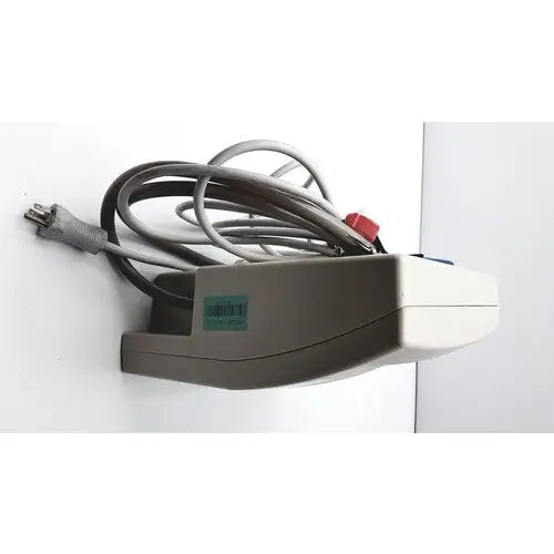 Gray and white wall-mounted Gaymar SPR Plus III power strip with coiled gray cords for medical use