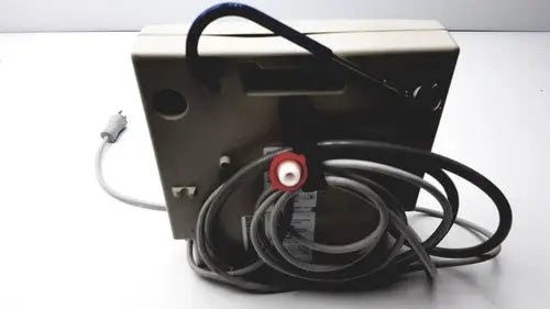 Beige rectangular Gaymar SPR Plus III electronic device with coiled black cables and red circular connector on back side