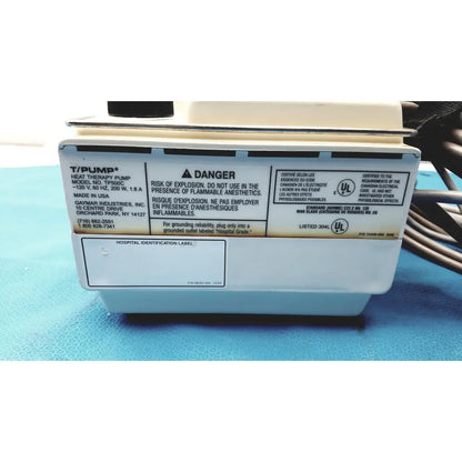 White rectangular gaymar t pump heat therapy pump tp500c with black and beige labeling by gaymar industries inc