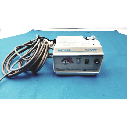 White and gray Gaymar T/Pump TP500C medical-grade pump heat therapy device with coiled black power cord