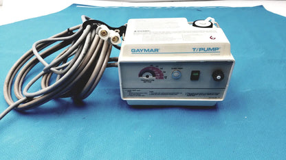 White and gray Gaymar T/Pump TP500C medical-grade pump heat therapy device with coiled black power cord
